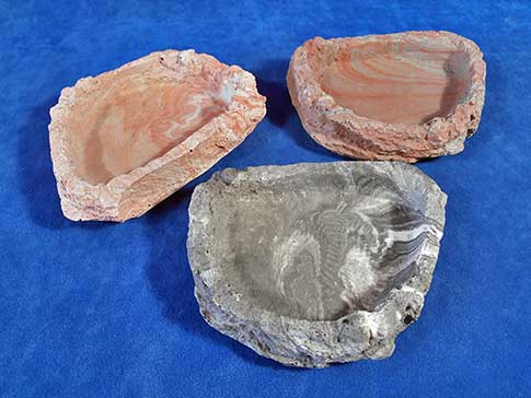 Large shallow resin rock dishes.