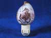 Seahorse carved into a cowrie seashell and then turned into a nightlight.