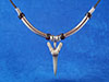 Fossil shark tooth necklace with tube beads.